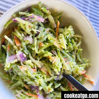 WW Broccoli Slaw Salad in a white bowl with a fork