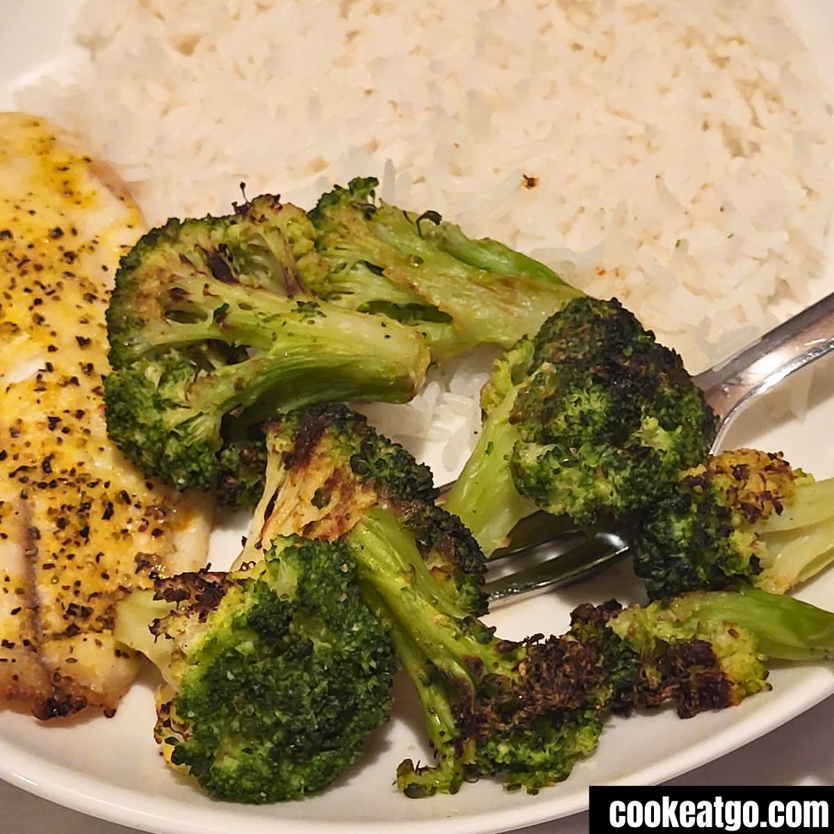 Air fryed Broccoli Served with white rice and tilapia