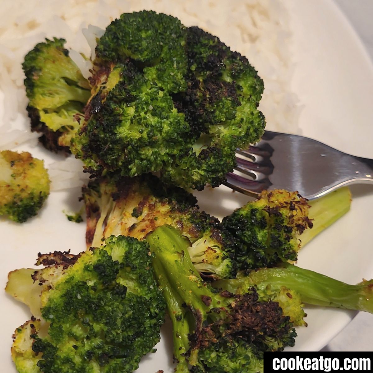 Air Fryed roasted broccolie on a fork