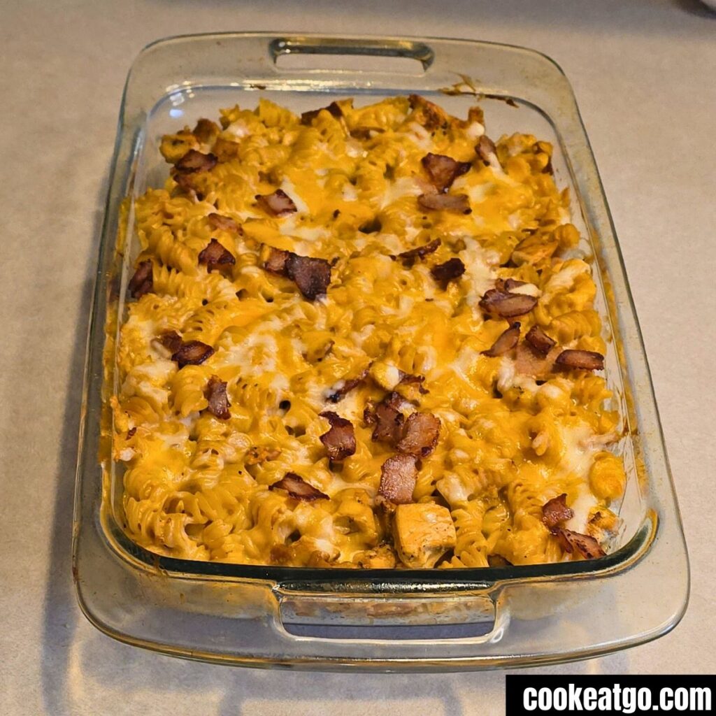 Cooked Chicken and Bacon Pasta Bake in a casserole dish