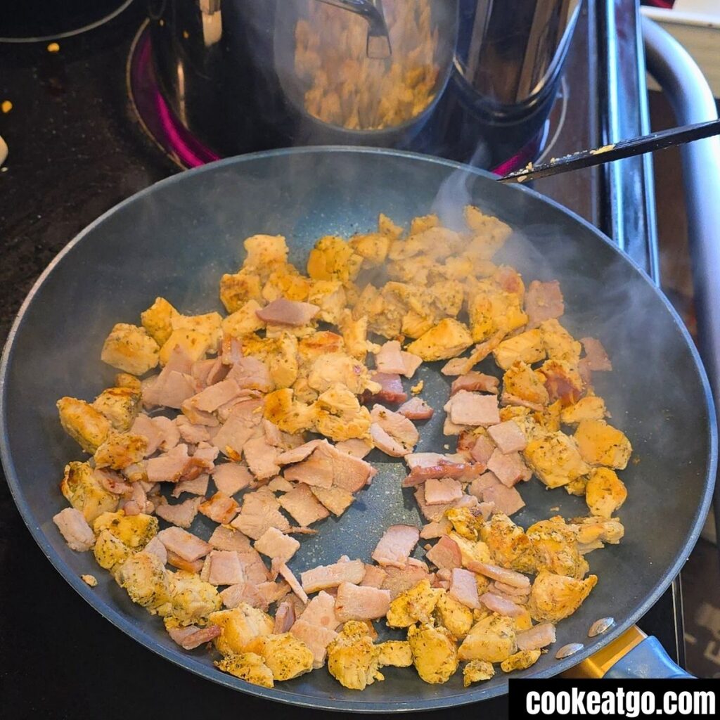 Chicken and Candian Bacon in Skillet cooking