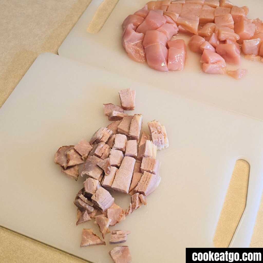Diced Chicken breast and diced candian Bacon on cutting boards