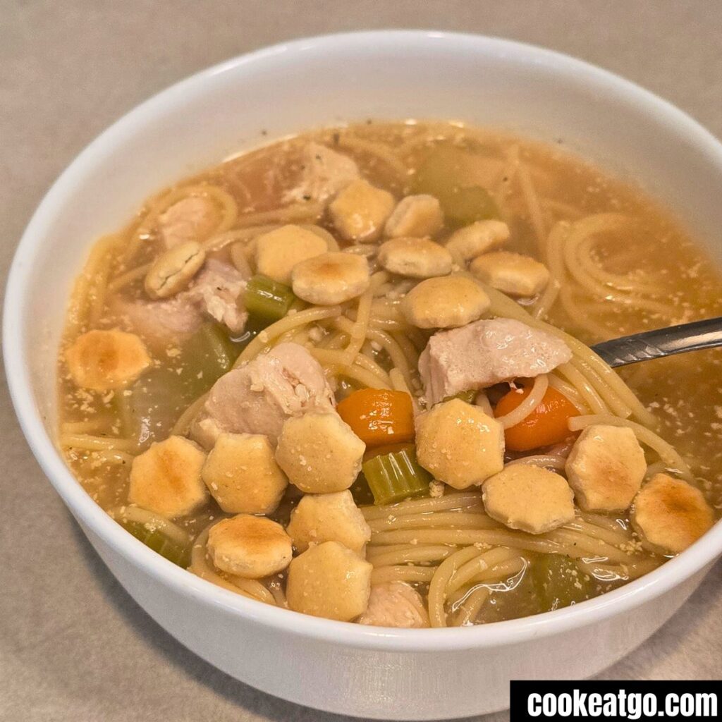 High Protein Chicken Noodle Soup Served With Oyster Crackers