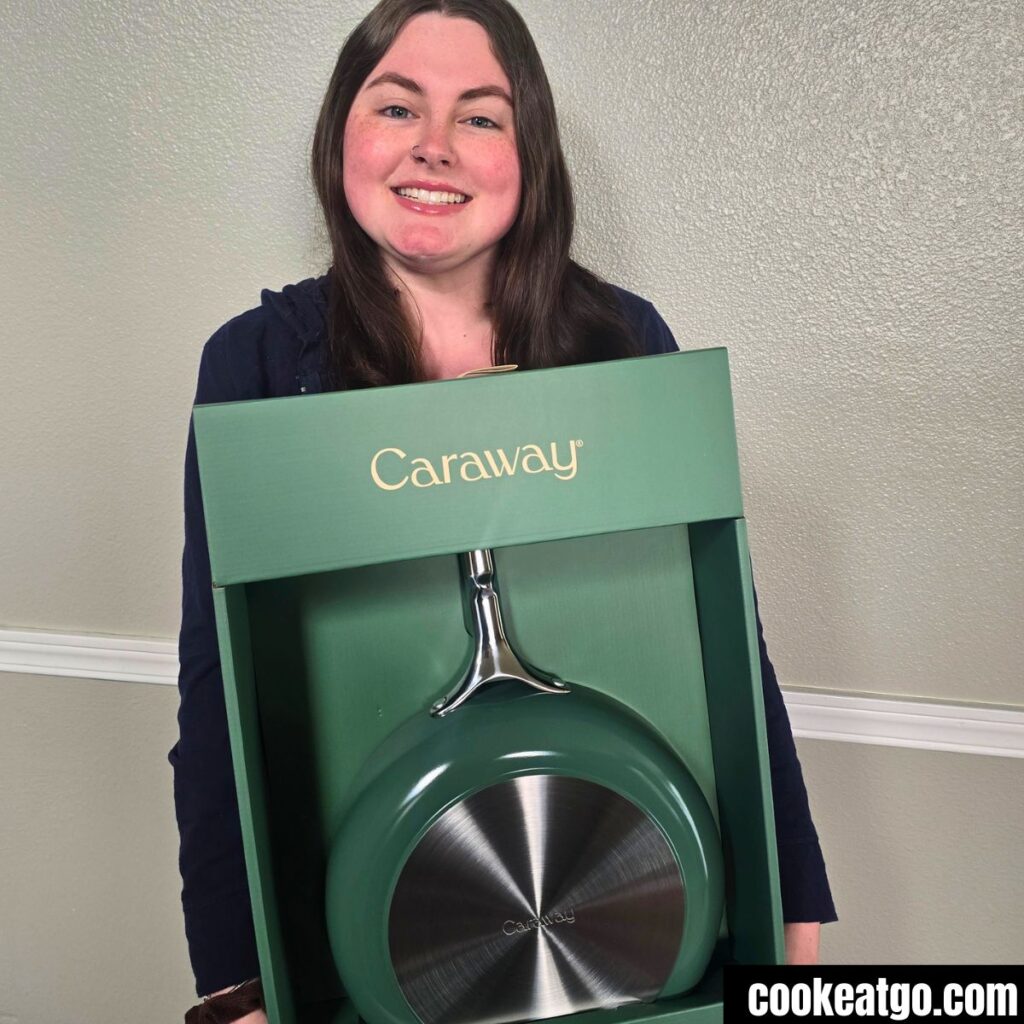 Kylie holding a Caraway Saute Pan 