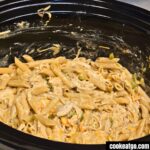 Slow Cooker Chicken Pot Pie Pasta mixed in crockpot