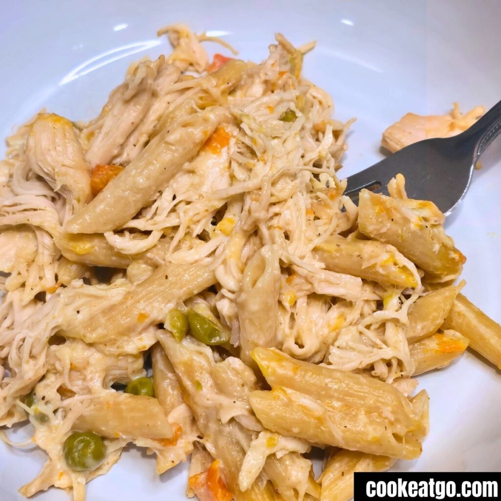 Slow Cooker Chicken Pot Pie Pasta served on a white plate
